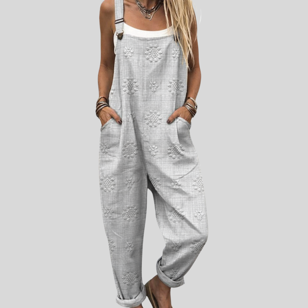 Graue Latzhose mit Blütenmuster